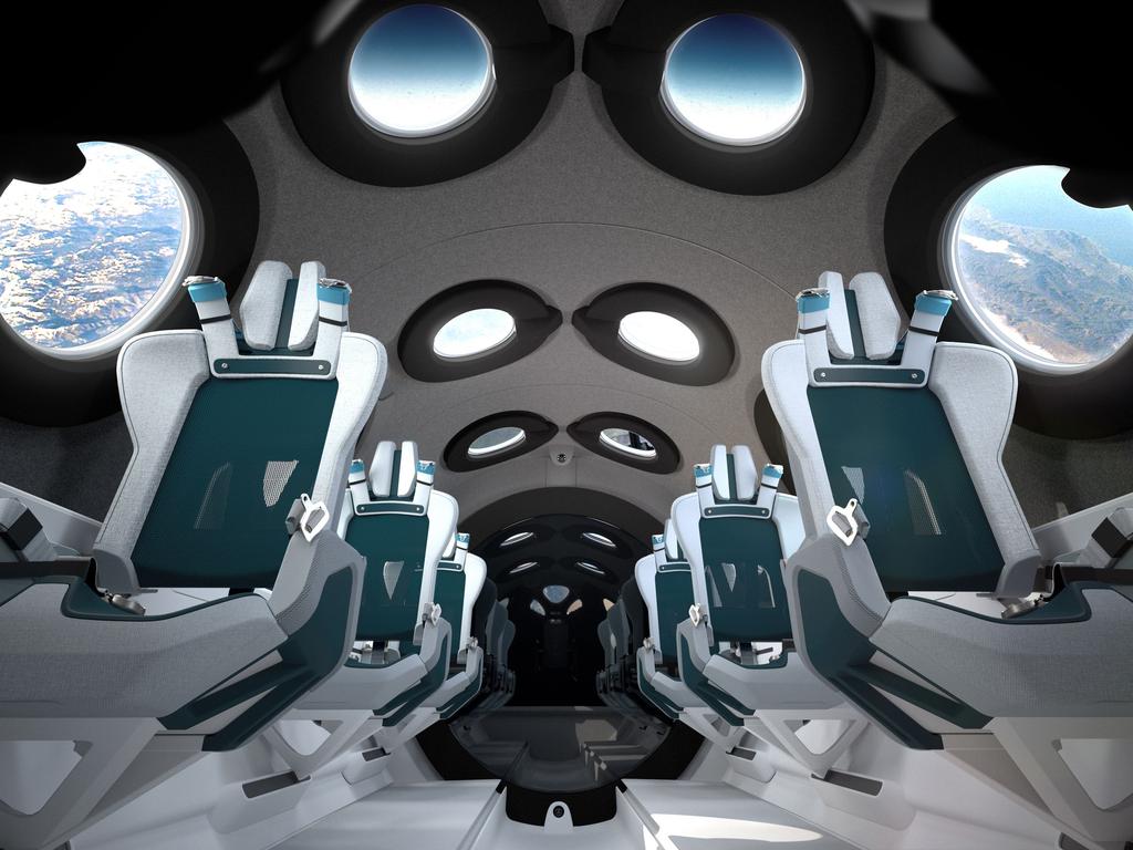 Image courtesy of Virgin Galactic obtained July 28, 2020 shows the Virgin Galactic spaceship cabin design and seats. - Virgin Galactic revealed the cabin interior of its first SpaceshipTwo vehicle, VSS Unity in a virtual livestreamed event on Tuesday. Each seat has been engineered to match the dynamism of the flight. A pilot-controlled recline mechanism, optimally positions astronauts to manage G- forces on boost and re-entry and frees up cabin space to maximize an unrestricted astronaut float zone when in zero gravity. (Photo by Handout / Virgin Galactic/The Spaceship Company / AFP) / -----EDITORS NOTE --- RESTRICTED TO EDITORIAL USE - MANDATORY CREDIT "AFP PHOTO / VIRGIN GALACTIC " - NO MARKETING - NO ADVERTISING CAMPAIGNS - DISTRIBUTED AS A SERVICE TO CLIENTS  - NO ARCHIVES