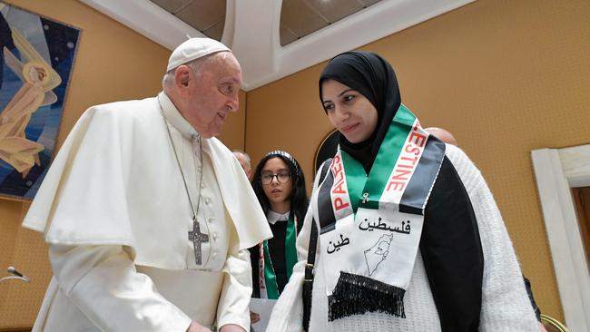 The Pope meets a family member of Palestinians living through the war in Gaza at the Vatican on Wednesday. Picture: AFP