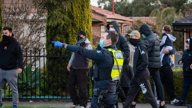 Police threatened to use pepper spray in a tense stand-off with anti-lockdown protesters in Dandenong. Officers clashed with a group of about 100 people in Dandenong. Picture: Jason Edwards