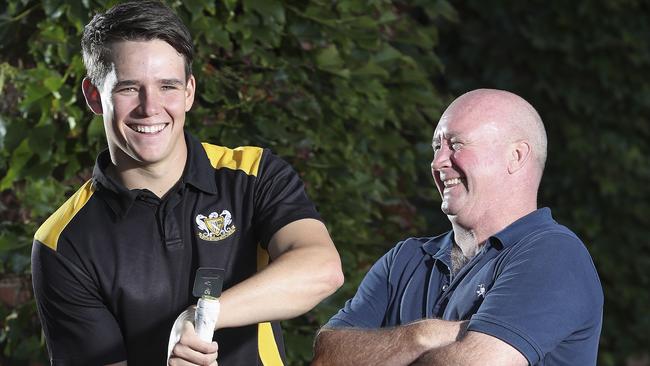 CHAMPION: Glenelg’s Jake Winter with Kookaburra’s Tom Parkinson after winning the inaugural The Advertiser/Kookaburra Champion Player of the Season award. Picture: Sarah Reed