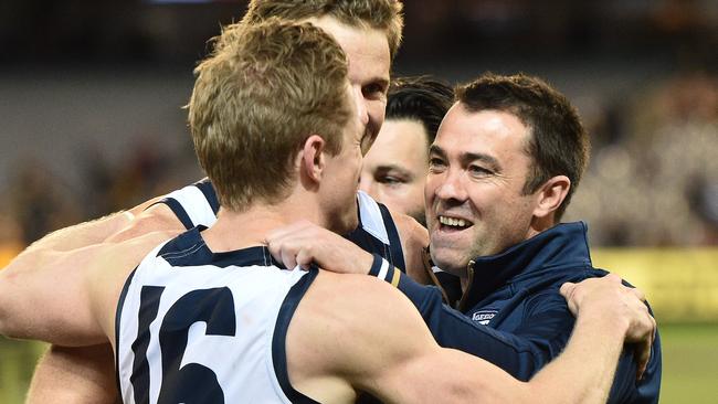 Chris Scott celebrates with his players after the win over Richmond.