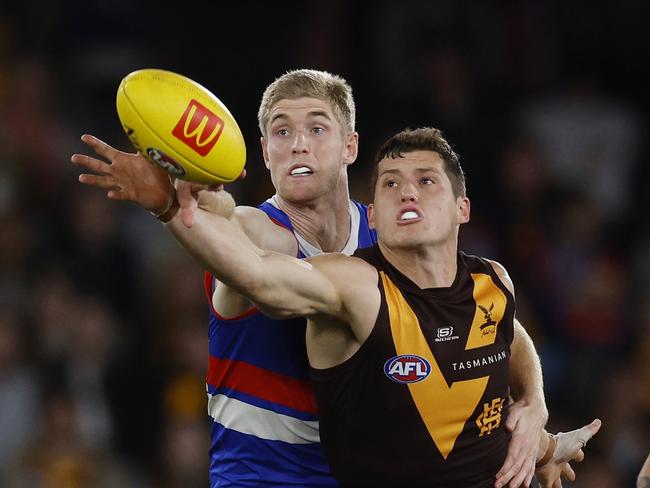 MELBOURNE, AUSTRALIA. May 4, 2024. AFL Round 8. . Western Bulldogs vs. Hawthorn at Marvel Stadium. Lloyd Meek of the Hawks and Bulldog Tim English battle in the ruck. Pic: Michael Klein