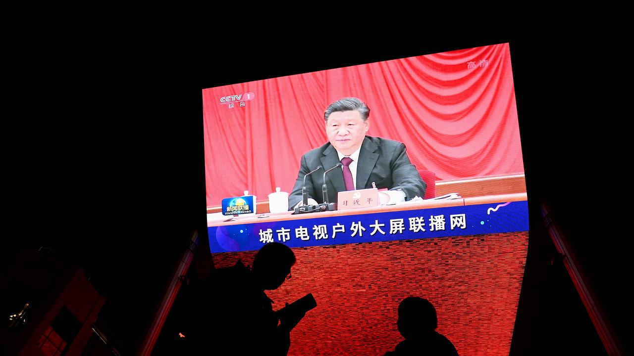 China's President Xi Jinping during an evening news program at a mall in Beijing on November 11. Picture: Noel Celis / AFP