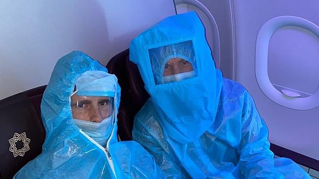 Cricketers Kane Williamson (L) &amp; David Warner (R) pictured aboard a flight in hazmat attire. Picture: Instagram @davidwarner31