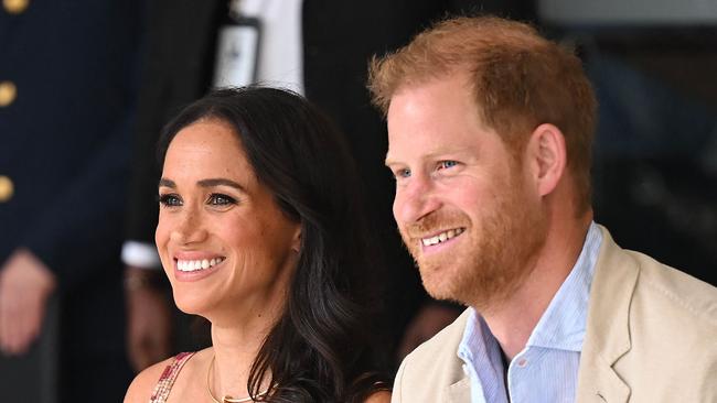 Britain's Prince Harry (R), Duke of Sussex, and his wife Meghan Markle are pictured during a visit to the National Centre for the Arts in Bogota on August 15, 2024. Prince Harry and his wife, American actress Meghan Markle, arrived in Colombia at the invitation of Marquez, with whom they will attend various meetings with women and young people to reject discrimination and cyberbullying. (Photo by RAUL ARBOLEDA / AFP)