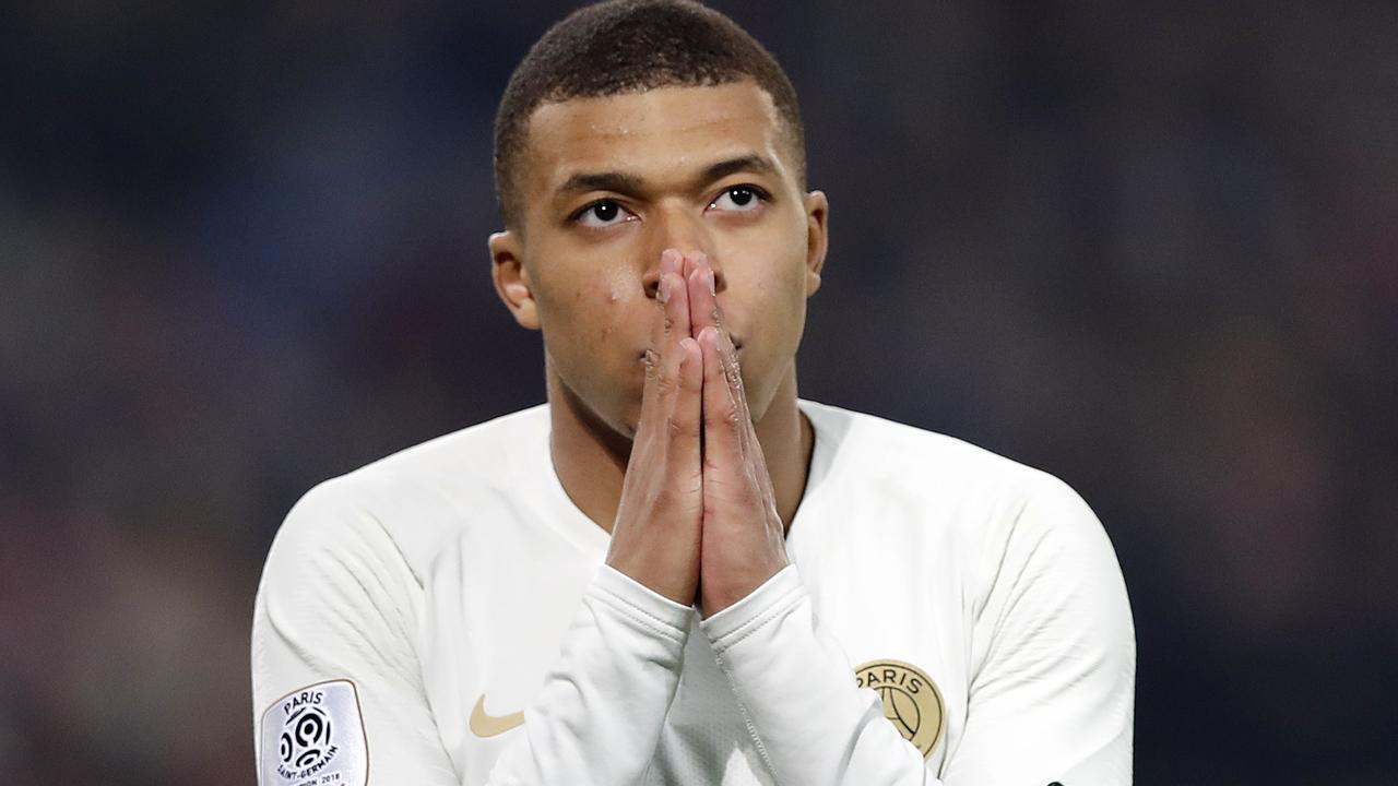 PSG's Kylian Mbappe reacts after he failed to score