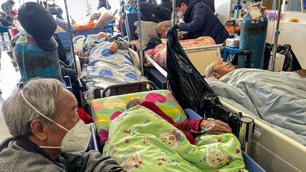 Patients on stretchers are seen at Tongren hospital in Shanghai. Picture: Hector Retamal / AFP