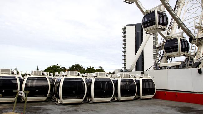 The 'Wheel of Surfers Paradise' being slowing pulled down from it's position in Surfers Paradise