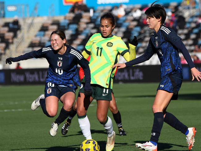 Japanâs Fuka Nagano (L) reacts as she gets tangled with Australiaâs Mary Fowler during the SheBelieves Cup football match between Japan and Australia at Shell Energy Stadium in Houston, Texas, on February 20, 2025. (Photo by Mark Felix / AFP)