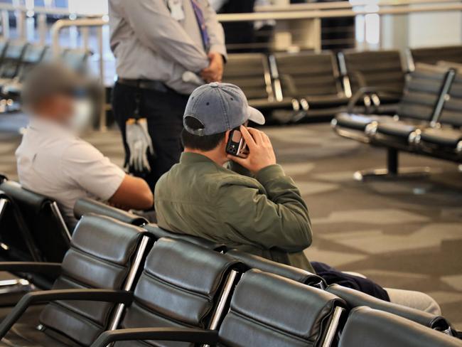 Binjun Xie at Melbourne Airport awaiting a deportation flight to China. Picture: Supplied