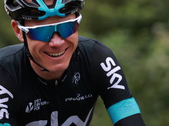 Great Britain's Christopher Froome smiles as he rides during the 237,5 km fouth stage of the 103rd edition of the Tour de France cycling race on July 5, 2016 between Saumur and Limoges. / AFP PHOTO / KENZO TRIBOUILLARD