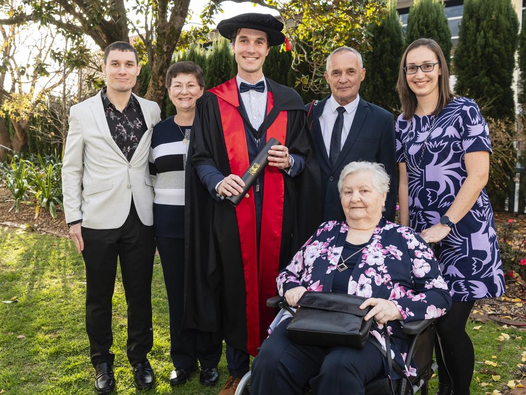 Doctor of Philosophy graduate Peter Gregor with family (from left) David Gregor, Jolan Gregor, Steven Gregor, Jolan Pajkos and Christina Gregor at a UniSQ graduation ceremony at Empire Theatres, Wednesday, June 28, 2023. Picture: Kevin Farmer