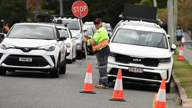 Traffic control during a Broncos fan training session at the Red Hill