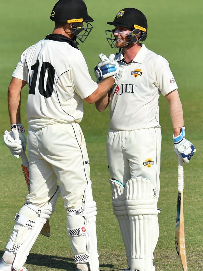 Will Bosisto (right) with Australian Test player Mitchell Marsh during their 185-run partnership for Western Australia against Queensland last season. Picture: DARREN ENGLAND (AAP).