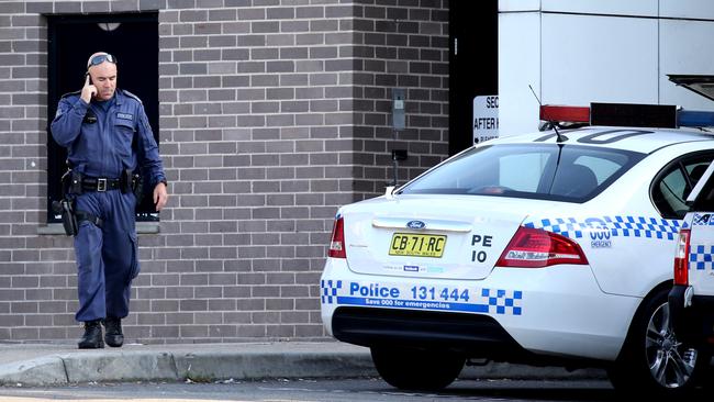 Police remain at the hospital this morning following the shooting of a colleague. Picture: Stephen Cooper