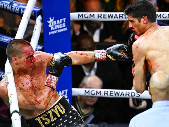 LAS VEGAS, NV - MARCH 30: (EDITORS NOTE: Image depicts graphic content) Tim Tszyu (in gold & black short) and Sebastian Fundora (in red & black short) exchange punches during their super welterweight world titles of the Premiere Boxing Championship on Saturday night as Sebastian Fundora wins at the T-Mobile Arena in Las Vegas, Nevada, United States on March 30, 2024. (Photo by Tayfun Coskun/Anadolu via Getty Images)