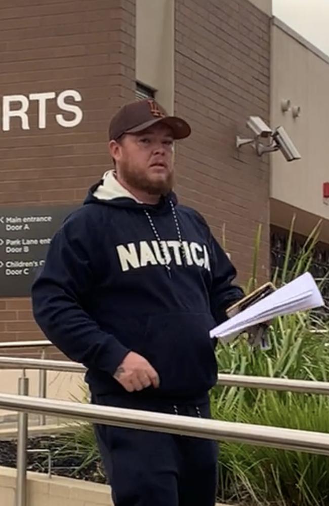 James Connors exits Heidelberg Magistrates Court after pleading guilty to unlawful assaults and property damage.