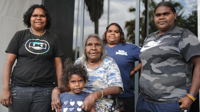 Enid Young (seated) outside the Alice Springs Supreme Court with her granddaughters Leocardia Young, Jodie Young, Monica Young and great great granddaughter Rebecca