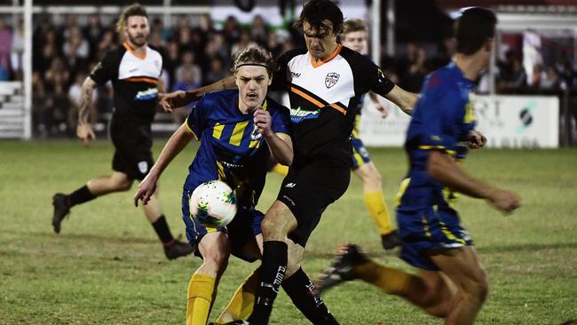 Across The Waves Luke Vincent and United Park Eagles Sam Porch battle for possession at Martens Oval.