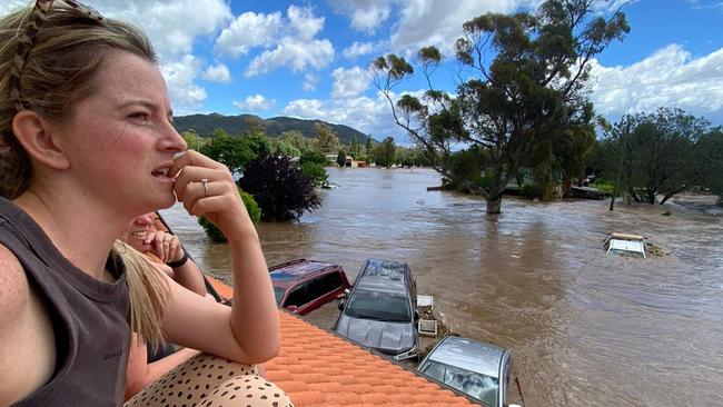 Chelsea Davies and her 19-month-old daughter Ruby were forced onto a neighbour’s roof as the waters rose.