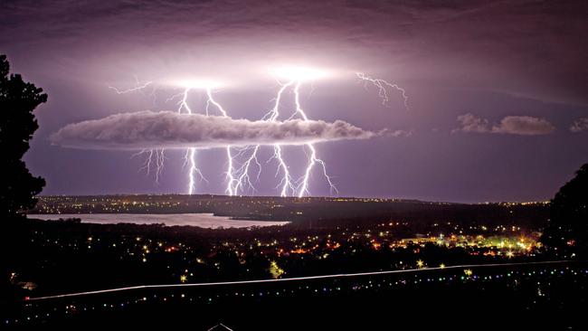 The Australian Weather Calendar 2021: Lightning over Gulf St Vincent and Happy Valley Reservoir, Adelaide. Picture: Jody Shadgett.