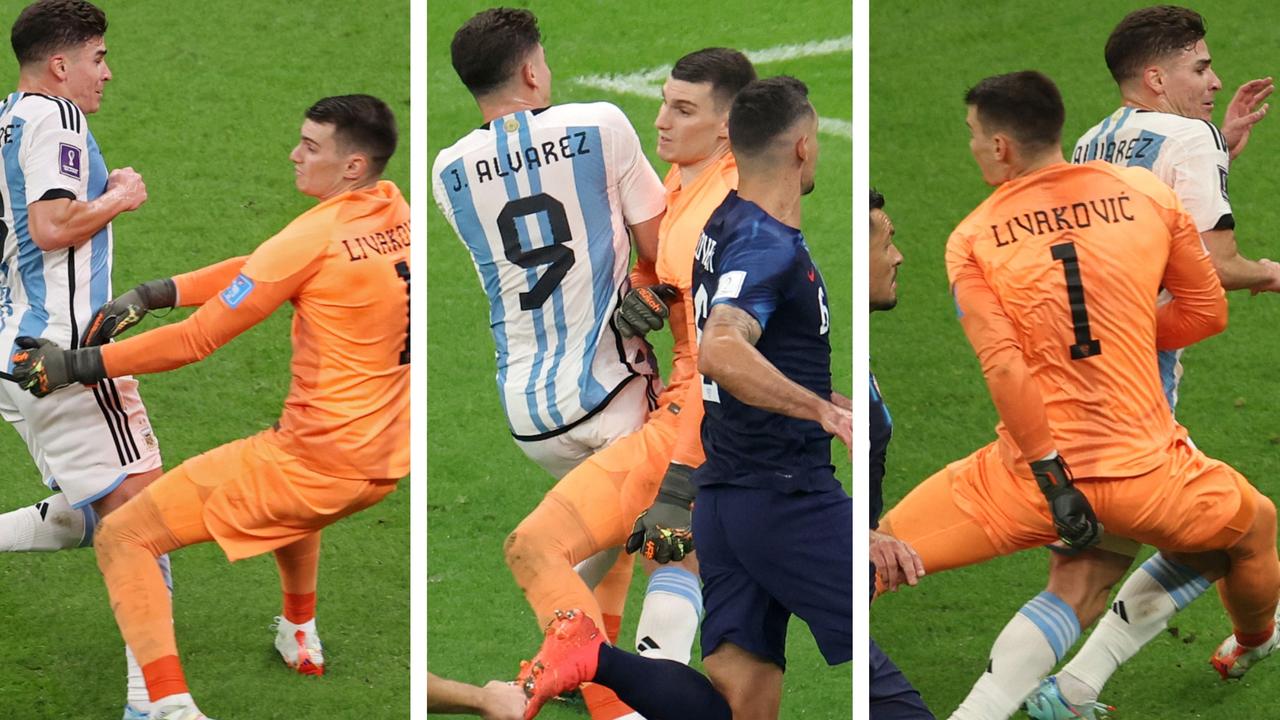 Forward Cristian Pavón, middle, of Argentina, holds up his new LA