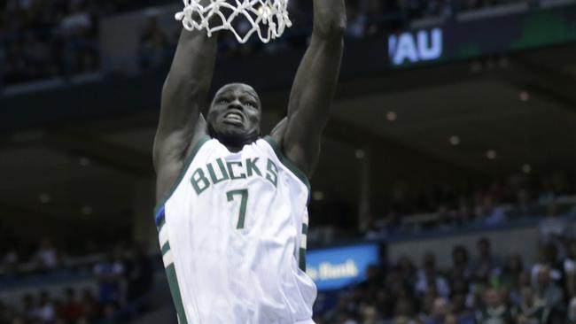 Thon Maker #7 of the Milwaukee Bucks drives to the hoop and draws the foul against the Toronto Raptors.