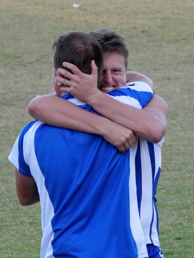 Langwarrin co-coaches Josh Beard and Blake McCormack embrace after the Kangaroos beat Chelsea last month.