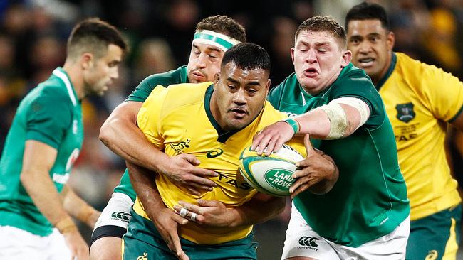 MELBOURNE, AUSTRALIA - JUNE 16:  Taniela Tupou of the Wallabies runs with the ball whilst being tackled during the International test match between the Australian Wallabies and Ireland at AAMI Park on June 16, 2018 in Melbourne, Australia.  (Photo by Daniel Pockett/Getty Images)