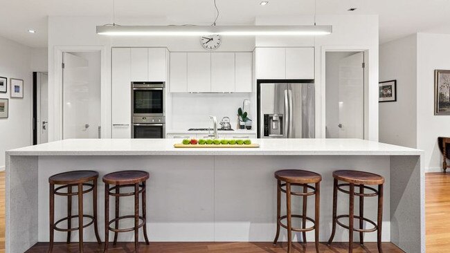 The kitchen has Caesarstone benchtops and Miele appliances.