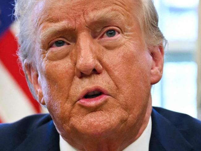 TOPSHOT - US President Donald Trump speaks to the press as he signs an executive order to create a US sovereign wealth fund, in the Oval Office of the White House on February 3, 2025, in Washington, DC. (Photo by Jim WATSON / AFP)