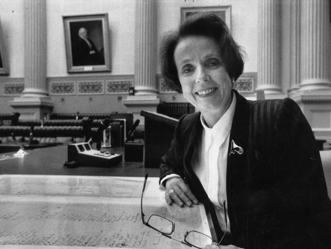 State Services Minister Anne Levy returning to the House of Assembly the historic 1894 petition on women's suffrage after its restoration by the State Library Preservation Services Branch in 1991.