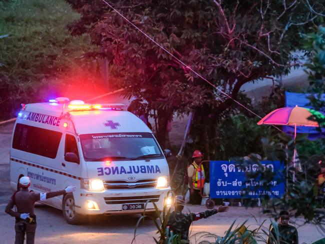 An ambulance carrying some of the rescued boys leaves the cave site. Picture: Getty Images