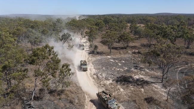 Australian Army Bushmaster's from Battlegroup Coral, conduct a forward passage of lines at the Townsville Field Training Area during Exercise Talisman Sabre 2021. Picture: Corporal Brandon Grey