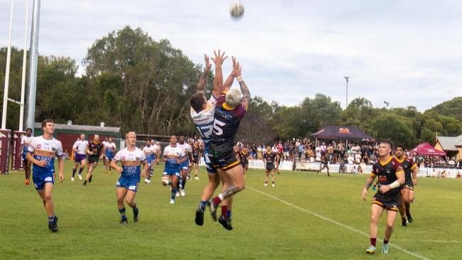 Coolum Colts winger Matt Withers contests a high ball against Noosa. Picture: PattmanSport.