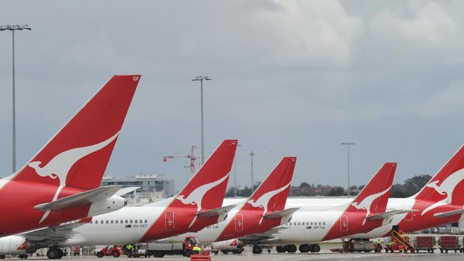**FILE** A file photo of Qantas planes at Sydney Airport, Sydney, Saturday, Nov. 6, 2010. Qantas announced on Tuesday, Aug. 16, 2011, it will make dramatic changes to its international business to make it profitable in a process that will affect 1,000 jobs. (AAP Image/Dean Lewins, File) NO ARCHIVING