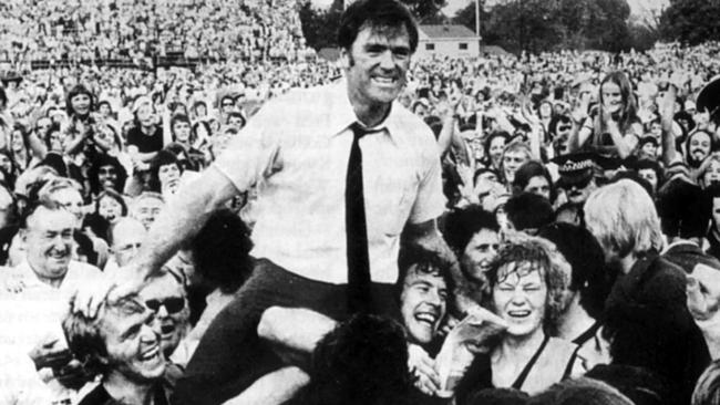 Neil Kerley is chaired by Tigers players Graham Cornes (left) and Fred Phillis after leading Glenelg to the 1973 flag. Picture: FILE PHOTO.