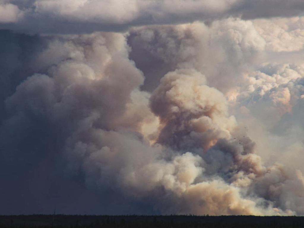 On Thursday, the fire was 15km (9 miles) northwest of the city. (Photo by Sylvia WEBSTER / UGC / AFP)