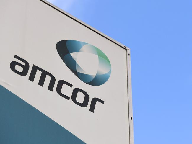 A sign of Australian packaging group Amcor is seen outside one of its packaging facilities in Melbourne on August 7, 2018. Australian firm Amcor announced a 6.8 billion USD buyout of US rival Bemis on August 7 to become the world's largest plastic packaging group, and will shift its primary listing to the New York Stock Exchange. / AFP PHOTO / William WEST