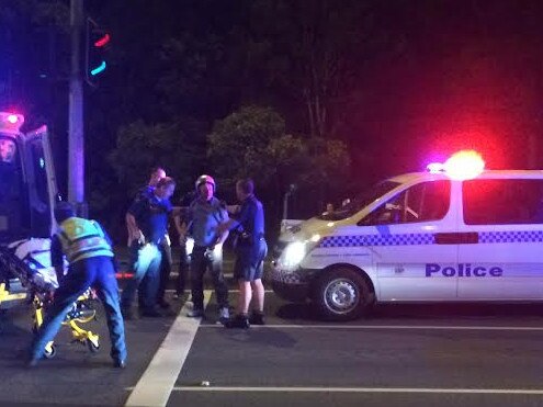 The scene of a crash between a moped and police van at Runaway Bay overnight. Photo: Steve Mckie.