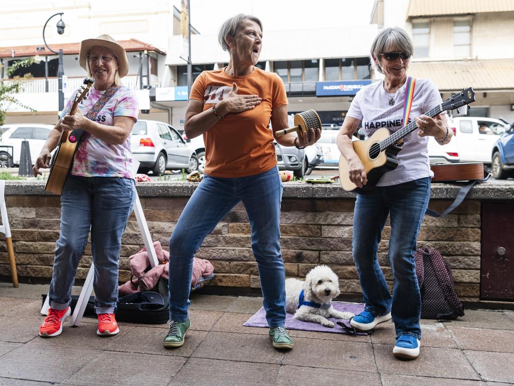 Lil Darlins members (from left) Cath McCourt, Karen James and Steph Gaunt with their dog Freddie travelled from Cleveland to perform at the Toowoomba Busking Festival, Saturday, April 29, 2023. Picture: Kevin Farmer