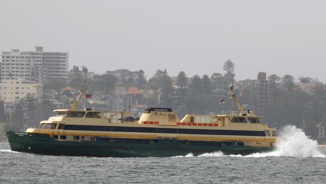 One of the old ferries — the Freshwater — pushing through a heavy swell on November 22. Picture: Jonathan Ng