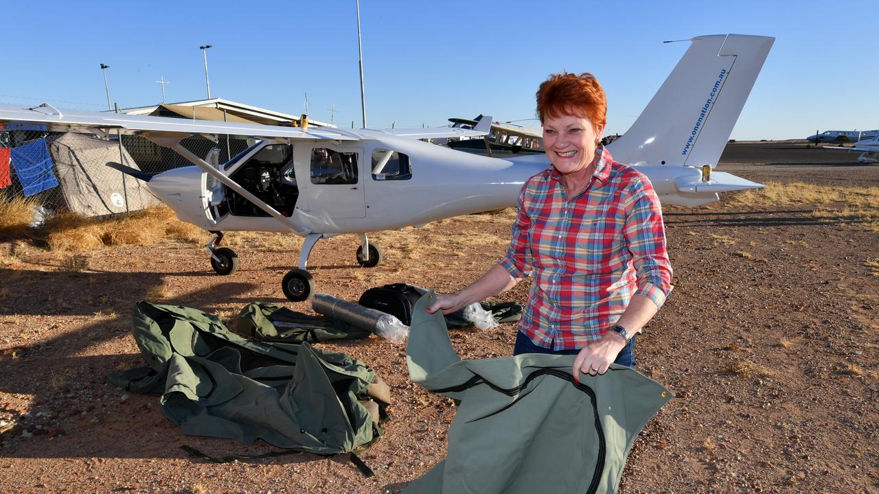 One Nation Senator Pauline Hanson setting up camp in Birdsville next to the light plane which she travelled in on in 2017. Picture: AAP Image/Darren England