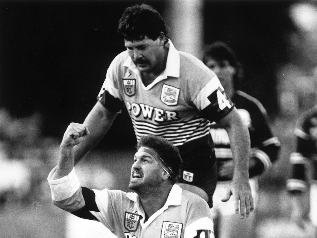 Greg Dowling and Gene Miles celebrate Brett Le Man’s opening try for the Broncos.