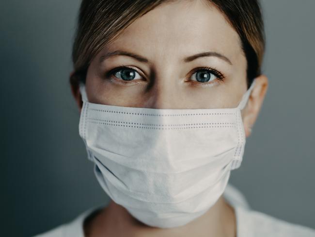 Doctor wearing protection face mask against coronavirus covid-19