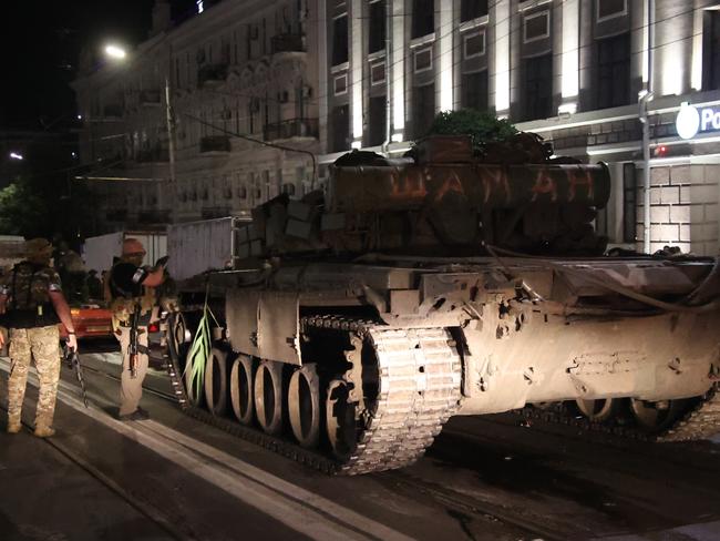 Wagner Group fighters prepare to depart from the Southern Military District's headquarters and return to their base late on Saturday in Rostov-on-Don, Russia. Picture: Getty Images