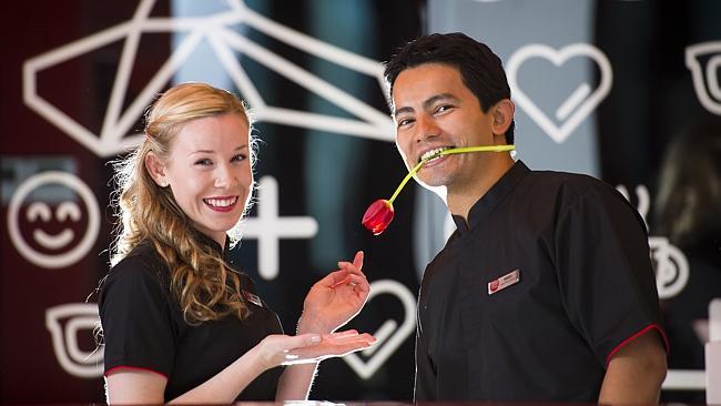 Tune Hotel Melbourne staff Hannah Orchard and Diogo Nakano. Picture: Stuart Walmsley