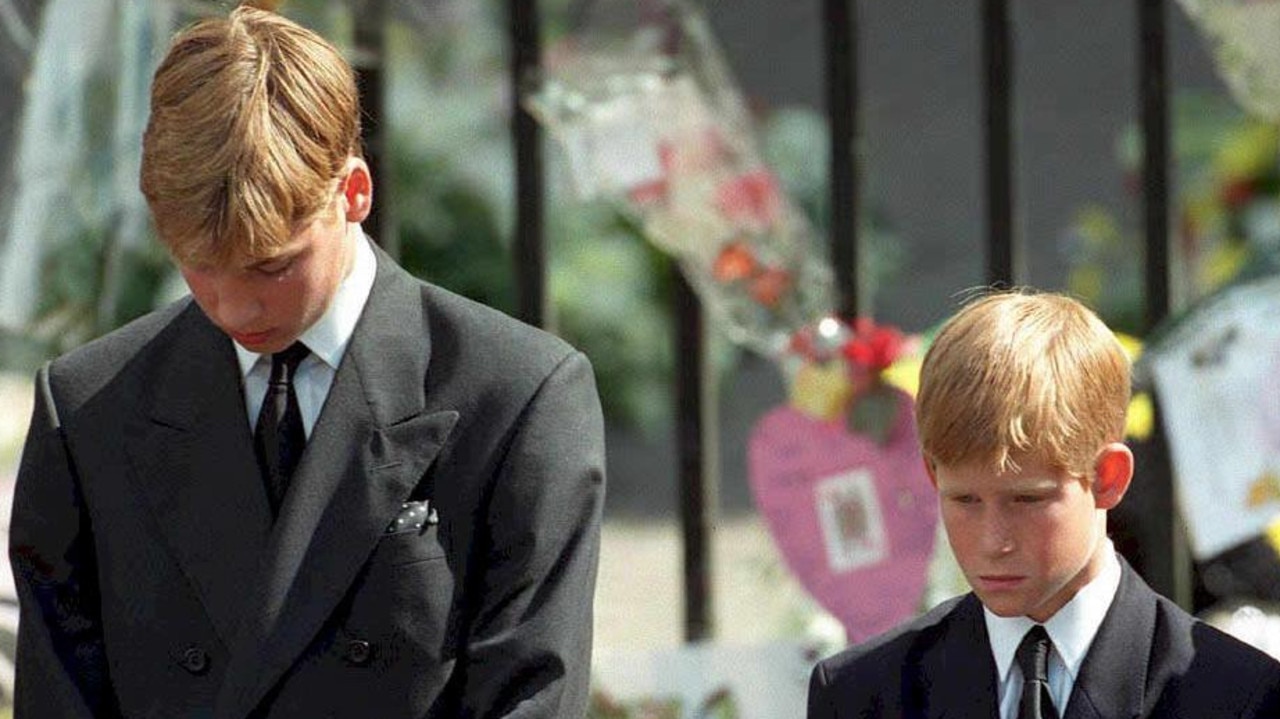 Prince William and Prince Harry bow their heads as their mother's Princess Diana’s coffin is taken out of Westminster Abbey following her funeral service. Picture: AFP PHOTO / POOL / Adam BUTLER