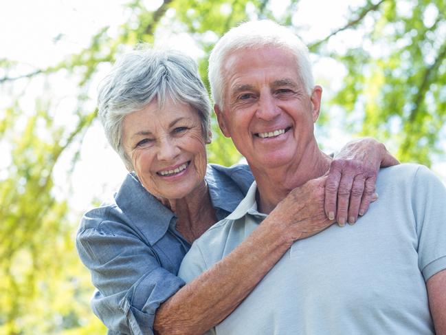 Quest Seniors Week - Alzheimers Australia.Happy old couple smiling in a park on a sunny day