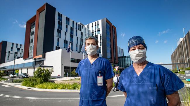 Portraits of staff at Northern Beaches Hospital in Frenchs Forest who are the frontline of the COVID-19 operation. Pictured (L-R) are: Matei Andrin and Helen Meischke. (AAP Image / Julian Andrews).